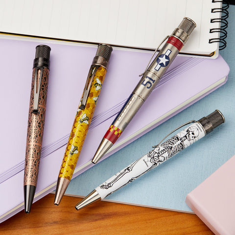 Retro 51 patterned pens arranged on pastel notebooks