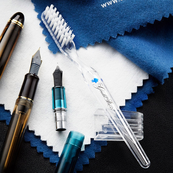 A fountain pen feed cleaning brush, featuring soft bristles that sweep away dried ink and other residue from the feed