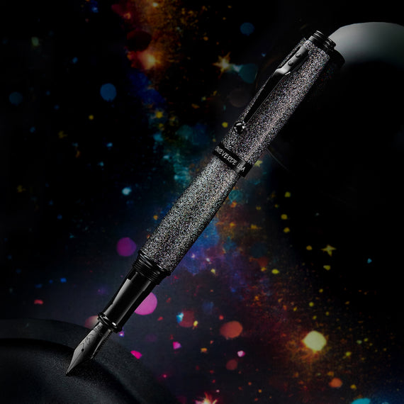 Fountain pen with textured black finish against a cosmic background