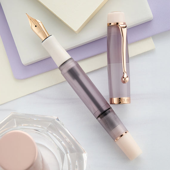 Fountain pen with rose gold accents on a light background