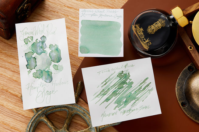 Ferris Wheel Press Hampton Harbor Sage ink bottle, swab and box on leather desk blotter