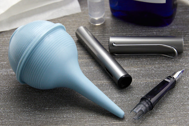 Goulet Tips and Tricks text over a fountain pen and inky splattered paper towels