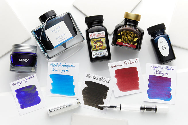Assorted brands of Bottled Ink and matching swabs