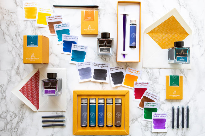 Jacques Herbin Premium Line items spread out on a desk