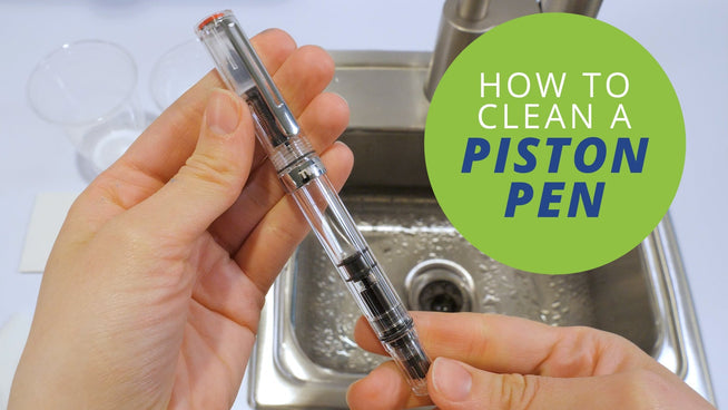 How to Clean a Fountain Pen: Piston-Filler text and hands holding a TWSBI fountain pen over a sink