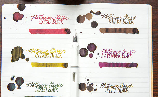 6 Platinum Ink colors on lined paper with ink drips on the page