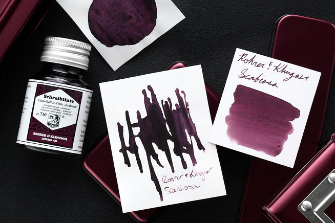 Rohrer & Klingner Scabiosa bottle and ink swap on purple themed background