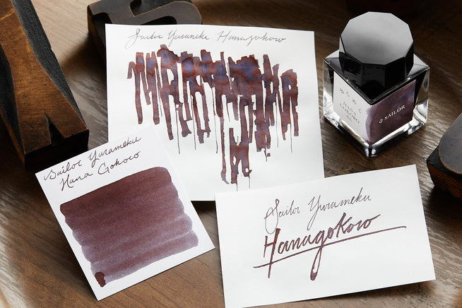 Sailor Yurameku Hana Gokoro Fountain pen ink, writing sample and swab on darker background