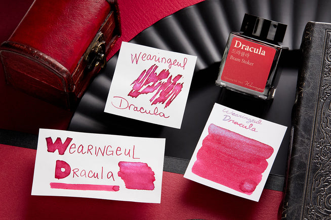 Wearingeul Dracula Fountain Pen ink swab, swatch and bottle on dark red and black background