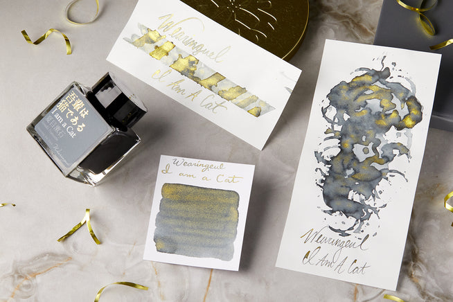 Wearingeul I am a cat fountain pen ink bottle, swab, swatch and writing sample on marble background