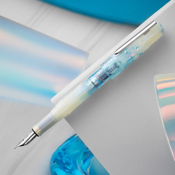 Fountain pen with a decorative cap on a light background