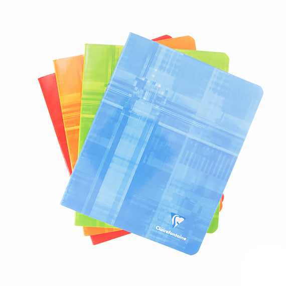 Set of colorful notebooks with a blue one in front on a white background