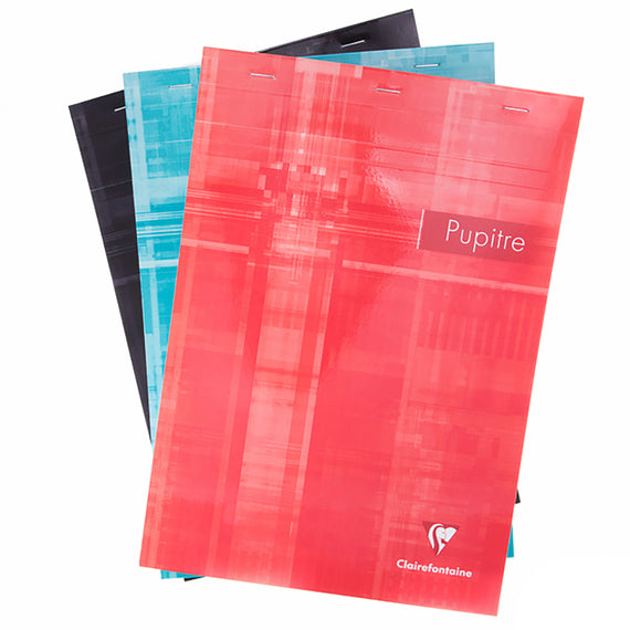 Set of colorful notebooks with 'Pupitre' and 'Clairefontaine' branding on a white background