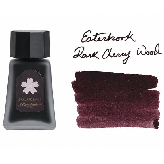 30ml bottle of Esterbrook Dark Cherry Wood ink next to a handwritten label and a swab swatch showing a deep brown-purple color.