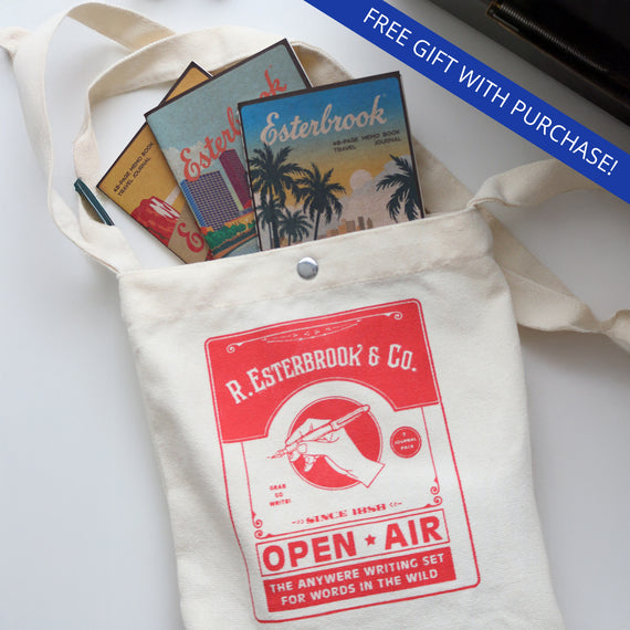 Canvas tote bag with R. Esterbrook & Co branding and stationery items on a white background
