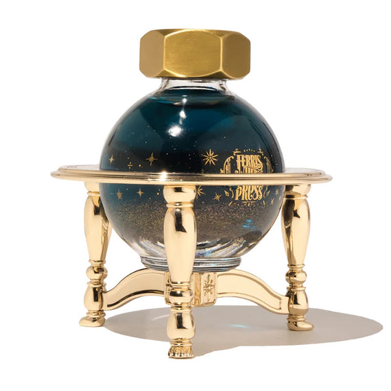 Blue ink bottle with gold cap and stand on a white background