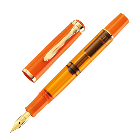 Orange fountain pen with gold accents on a white background