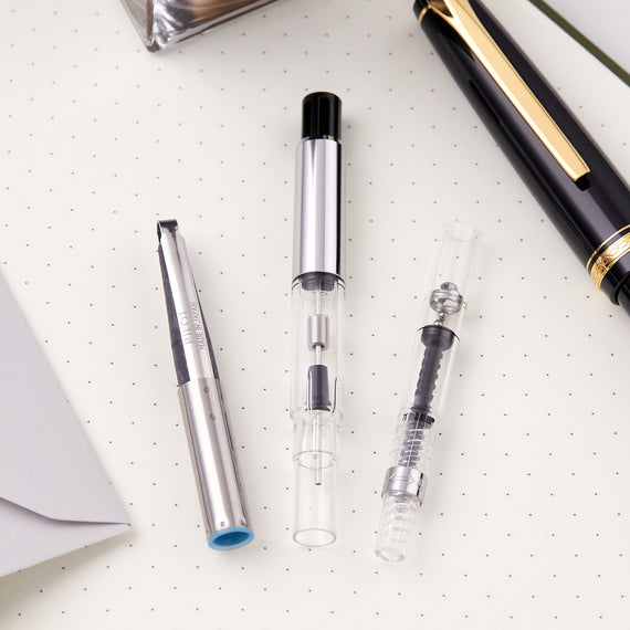 Three Pilot cartridge converters on a dot grid paper background