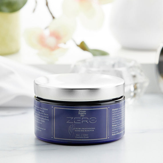 Jar of hand product with a blue label on a white surface