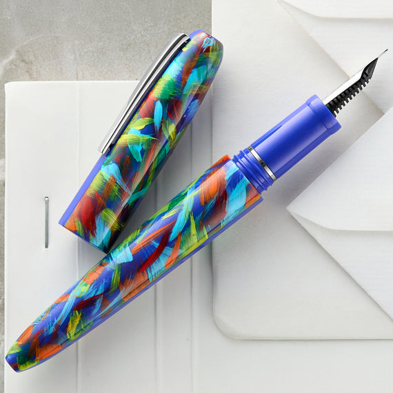 Colorful fountain pen on a white surface
