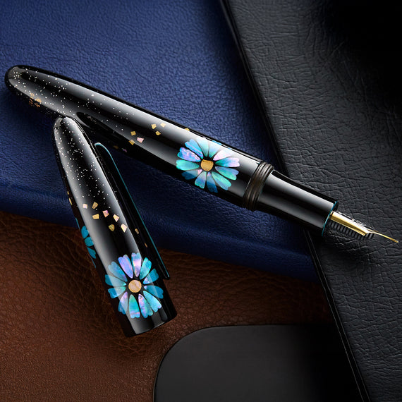 Pen with floral design on a textured surface