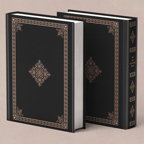 Two black bound books with decorative patterns on a beige background