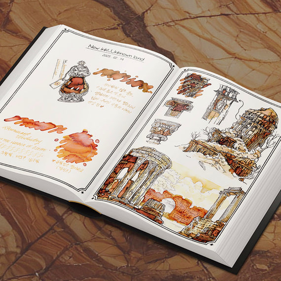 Open book with illustrations of architecture and design elements on a marble surface