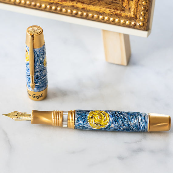 Fountain pen with artistic design on a marble surface