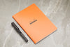 Rhodia Classic Side Staplebound A5 Notebook - Orange, Lined